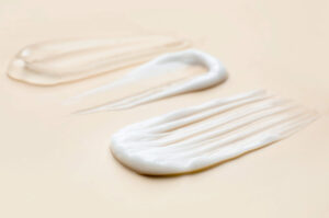Skincare product textures close up on a soft peach coloured background
